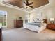 Relaxing main bedroom with a decorative ceiling, ample natural light and space at 2020 Holly Villa Cir, Indian Trail, NC 28079