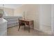 Cozy home office space with built-in shelving unit, complemented by a wooden desk and chair at 2020 Holly Villa Cir, Indian Trail, NC 28079
