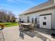 An outdoor patio with furniture is adjacent to a green lawn at 2020 Holly Villa Cir, Indian Trail, NC 28079