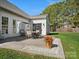 A patio with outdoor furniture is adjacent to a green lawn at 2020 Holly Villa Cir, Indian Trail, NC 28079