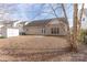 Large backyard with an installed storage shed and a home with tan siding at 212 Mary Caroline Springs Dr, Mount Holly, NC 28120