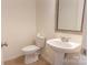 Clean bathroom features a sleek sink, a toilet and a mirror at 212 Mary Caroline Springs Dr, Mount Holly, NC 28120