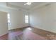Bright bedroom features hardwood floors, natural light from two windows and ceiling fan at 212 Mary Caroline Springs Dr, Mount Holly, NC 28120