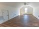 Large bonus room with plenty of light and wood flooring at 212 Mary Caroline Springs Dr, Mount Holly, NC 28120