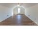Large bonus room with plenty of light and wood flooring at 212 Mary Caroline Springs Dr, Mount Holly, NC 28120