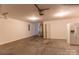 Spacious two-car garage with concrete floors, white walls, and a refrigerator at 212 Mary Caroline Springs Dr, Mount Holly, NC 28120