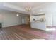 Open floor plan integrating kitchen, living room, and dining area, featuring modern finishes and flooring at 212 Mary Caroline Springs Dr, Mount Holly, NC 28120