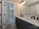 Modern bathroom featuring a double vanity with dark cabinets and black fixtures at 2204 Camber Dr # Cwo0076, Gastonia, NC 28054