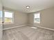 Well-lit bedroom featuring neutral walls, plush carpeting, and bright windows at 2204 Camber Dr # Cwo0076, Gastonia, NC 28054