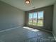 Well-lit bedroom with large window showcasing neighborhood views, ready for your personal touch at 2204 Camber Dr # Cwo0076, Gastonia, NC 28054
