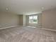 Spacious bedroom with large windows, neutral paint, and plush carpet at 2204 Camber Dr # Cwo0076, Gastonia, NC 28054