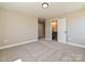 Neutral bedroom with plush carpet and open door to ensuite bathroom at 2204 Camber Dr # Cwo0076, Gastonia, NC 28054