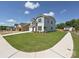 Beautiful two-story home with blue siding, a stone facade, and a well-manicured lawn at 2204 Camber Dr # Cwo0076, Gastonia, NC 28054