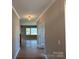Hallway with wood floors leading to living area and an adjacent doorway at 2204 Camber Dr # Cwo0076, Gastonia, NC 28054