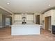 Bright kitchen features a large island, white cabinets, and stainless-steel appliances at 2204 Camber Dr # Cwo0076, Gastonia, NC 28054