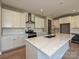 Modern kitchen boasts white cabinets, quartz countertops, and stainless steel appliances at 2204 Camber Dr # Cwo0076, Gastonia, NC 28054