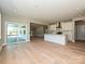 Bright kitchen with white cabinets, quartz countertops, stainless steel appliances, and hardwood flooring at 2204 Camber Dr # Cwo0076, Gastonia, NC 28054