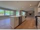 Modern kitchen with a large island, stainless steel appliances, and plenty of natural light at 2204 Camber Dr # Cwo0076, Gastonia, NC 28054