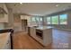 Kitchen island featuring white cabinets, stainless steel appliances, and a breakfast bar at 2204 Camber Dr # Cwo0076, Gastonia, NC 28054