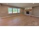 Open living area featuring a brick fireplace and large windows that bring in natural light at 2204 Camber Dr # Cwo0076, Gastonia, NC 28054
