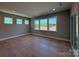 Living room featuring hardwood floors and large windows at 2204 Camber Dr # Cwo0076, Gastonia, NC 28054