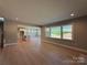 Bright living room with hardwood floors and large windows offering outdoor views at 2204 Camber Dr # Cwo0076, Gastonia, NC 28054