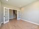 Office space with hardwood flooring and double doors leading to the staircase at 2204 Camber Dr # Cwo0076, Gastonia, NC 28054