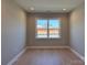 Neutral room with a large window providing ample natural light; freshly painted at 2204 Camber Dr # Cwo0076, Gastonia, NC 28054