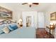 Comfortable bedroom featuring hardwood floors, soft lighting, and an ensuite bathroom at 3008 Sweetleaf Dr, Fort Mill, SC 29707