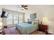 Cozy bedroom with hardwood floors, soft natural light, and a comfortable queen-size bed at 3008 Sweetleaf Dr, Fort Mill, SC 29707