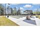 Outdoor bocce ball courts with benches and covered seating in Sun City Carolina Lakes at 3008 Sweetleaf Dr, Fort Mill, SC 29707