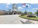 Exterior shot of the Sun City Carolina Lakes clubhouse with American and SC State Flags at 3008 Sweetleaf Dr, Fort Mill, SC 29707