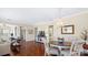 Charming dining area featuring a wood table, elegant chandelier, and hardwood floors at 3008 Sweetleaf Dr, Fort Mill, SC 29707