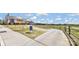 Scenic sidewalk leading to the driving range and clubhouse in Sun City Carolina Lakes at 3008 Sweetleaf Dr, Fort Mill, SC 29707