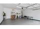 Spacious garage featuring painted floor, overhead door, overhead lighting, and shelving at 3008 Sweetleaf Dr, Fort Mill, SC 29707