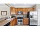 Kitchen features stainless steel appliances, wood cabinetry and tile backsplash at 3008 Sweetleaf Dr, Fort Mill, SC 29707