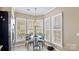 Bright eat-in kitchen showcasing stainless appliances, windows with wooden shutters and table with two chairs at 3008 Sweetleaf Dr, Fort Mill, SC 29707