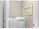 Bright laundry room features a modern washer and dryer, and neutral paint at 3008 Sweetleaf Dr, Fort Mill, SC 29707