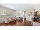 Bright living room with large windows, hardwood floors, and a comfortable seating area at 3008 Sweetleaf Dr, Fort Mill, SC 29707