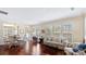 Inviting living room featuring hardwood floors and lots of natural light from shuttered windows at 3008 Sweetleaf Dr, Fort Mill, SC 29707