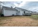 View of backyard with a wooden deck attached to the side of the home at 3248 St Vincent Dr, Claremont, NC 28610