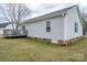 View of backyard with a wooden deck attached to the side of the home at 3248 St Vincent Dr, Claremont, NC 28610