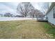 Fenced-in backyard with mature trees and a wooden deck attached to the home at 3248 St Vincent Dr, Claremont, NC 28610