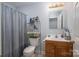 Bathroom featuring a sink and vanity, commode, and a shower with a curtain at 3248 St Vincent Dr, Claremont, NC 28610