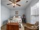 Bedroom with a decorative bed frame, window, wooden chest, and a wicker chair at 3248 St Vincent Dr, Claremont, NC 28610