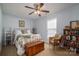 Bedroom with a decorative bed frame, window, wooden chest, and a wicker chair at 3248 St Vincent Dr, Claremont, NC 28610