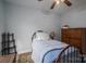Cozy bedroom with a wooden bed frame, blue comforter, and neutral colored walls at 3248 St Vincent Dr, Claremont, NC 28610