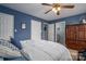 Bedroom featuring blue walls and a glimpse into the bathroom at 3248 St Vincent Dr, Claremont, NC 28610