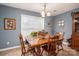 Traditional dining room with wood table, chairs, and large window at 3248 St Vincent Dr, Claremont, NC 28610