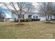 Inviting single-story home with manicured front yard, featuring well-placed trees and shrubbery at 3248 St Vincent Dr, Claremont, NC 28610